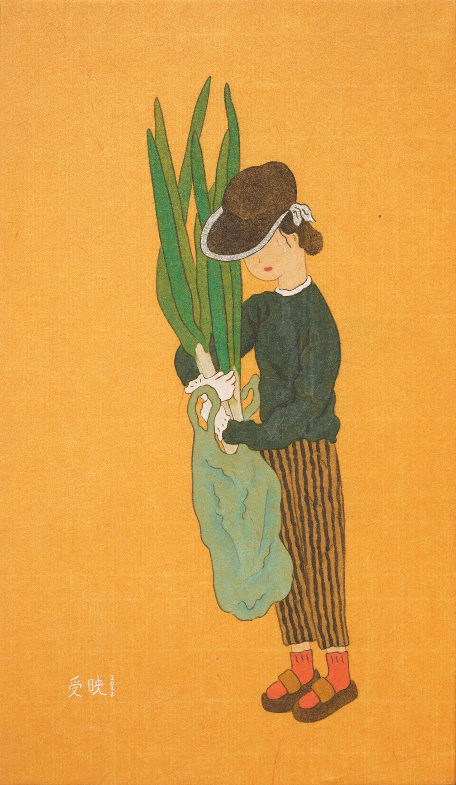 A woman with green onions